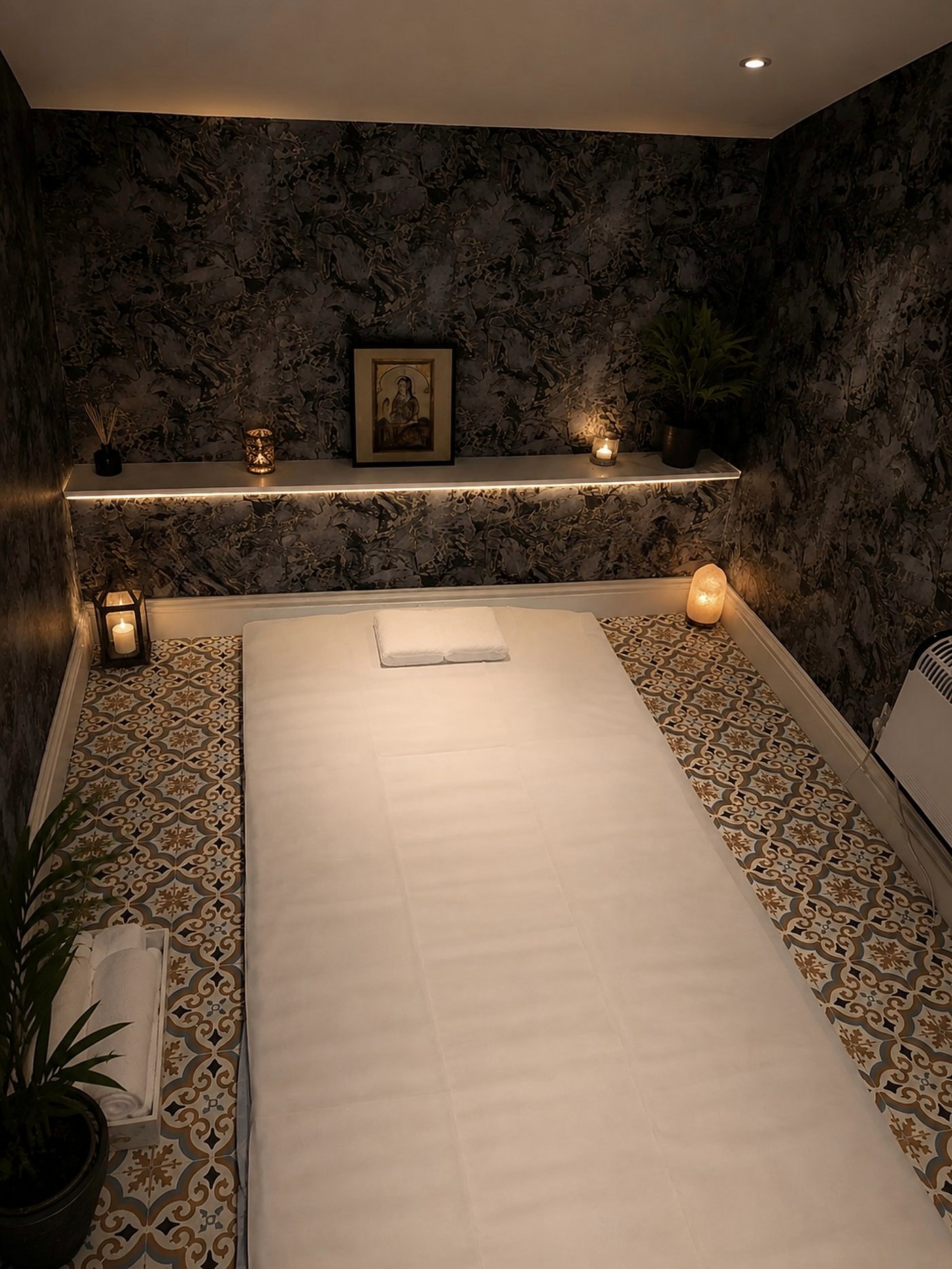 One of the massage rooms at The Maltings, made up and lit